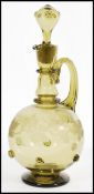 A 19th century green glass claret jug decanter in the manner of Roemer having a large bulbous body