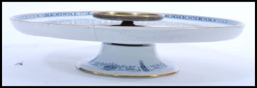 A Wedgwood porcelain lazy Susan serving platter on rotating stand decorated with flowers. Makers