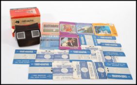 A View-master 3-Dimension Viewer in its original box along with a selection of slides including
