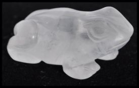A 19th century Chinese carved crystal figurine of a frog. Made from a clear rock crystal. 5cm long.
