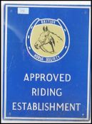 A retro 20th Century glass advertising sign, the sign on blue ground advertising APPROVED RIDING