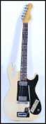 A vintage 1960's Hofner six string electric guitar having a white / cream vinyl body with black