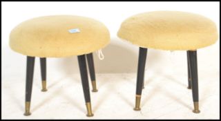 A pair of mid century retro vintage ottoman stools. Each with wool circular roundel stuffed seats