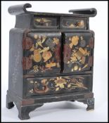 A believed 19th century Japanese table top / ladies jewellery cabinet having black lacquered