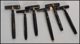 A group of vintage 20th century fountain pens to include Swan 14ct gold nib, Burnham 14ct nib,