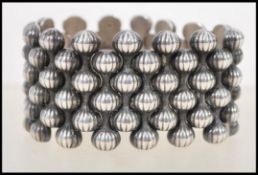A sterling silver Georg Jensen bracelet by Arno Malinowski, Onion design, no. 110 from 1956. Fully
