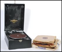 A vintage 20th century portable record player gramophone by Columbia having hinged lid with fitted
