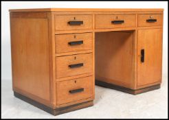 A good 1930's Art Deco golden oak twin pedestal desk - Air Ministry manner. The green writing