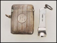 A silver hallmarked cheroot cutter along with a silver hallmarked vesta case. The vesta match case