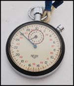 A vintage 20th century Tag Heuer stopwatch timer complete in original box. White enamel face with