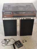 A retro teak cased HMK - 70 Sony music system, record deck, radio and tape deck, lift up acrylic top