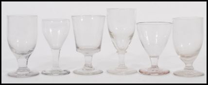 A harlequin set of small rummer glasses dating from the early 19th Century to include Georgian and