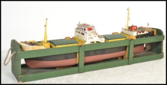 A very large scratch built wooden and metal model of a boat with inset engine complete with