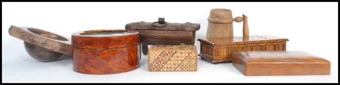 A collection of vintage treen ware dating from the 19th century to include a coconut carved into a