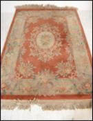 A 20th century Chinese wool rug of large proportio