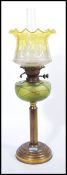 A Victorian 19th century Loetz glass and brass oil lamp. The neo-classical brass body with reeded