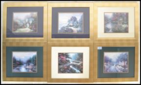 A set of six vintage Thomas Kinkade prints being set to gilt frames. Each depicting a busy scenes