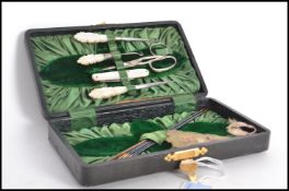 A fabulous 19th century Victorian cased sewing set in fitted case. Consists of carved mother of