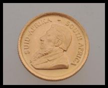 A 1/10th 0z fine gold Krugerrand gold coin dated 1982.