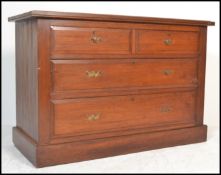 An early 20th century Edwardian mahogany cottage chest of drawers. The bank of two over three