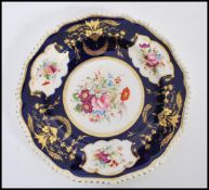 A 19th century Bloor Derby cabinet plate having a deep painted blue cobalt ground with hand