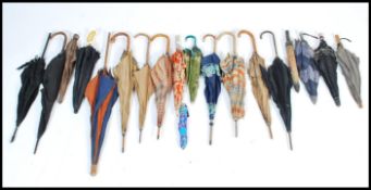 A large collection of vintage early 20th century Edwardian and 1920's Art Deco umbrellas /
