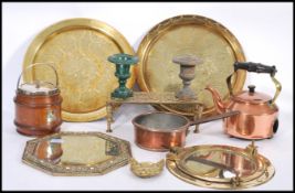 A collection of copper and brass dating from the 19th century to include copper victorian pan, brass