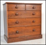 A 19th century Victorian mahogany 2 over 3 chest of drawers. Raised on a plinth base with 2 short