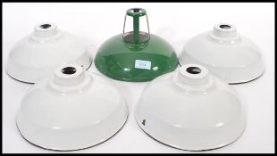 A collection of vintage 20th Century industrial factory enamelled ceiling pendant light shades /