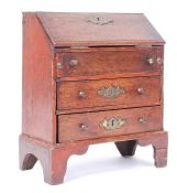 A 19th Century Victorian miniature dolls house mahogany bureau having brass batwing key
