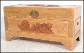 A mid century Chinese hardwood, possibly camphor wood coffer / blanket box chest with profusely