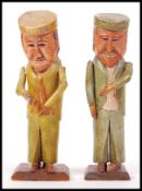 PAIR OF ANTIQUE FOLK ART STYLE CARVED WOODEN FIGUR