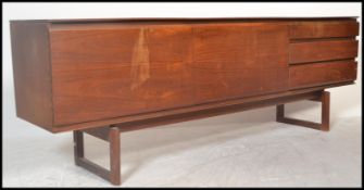 A White & Newton retro vintage teak wood sideboard credenza having a central cupboard flanked by a