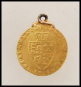 An 18th century Georgian George III 1789 1/2 Guinea being mounted. Weighs 4.3 grams.