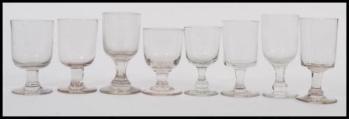 A selection of 19th Century Georgian rummer drinking glasses with some having faceted columns,