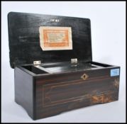 A 19th century Georgian small  rosewood and marquetry inlaid cylinder music box. Of  unusual