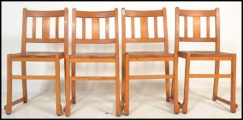 A set of 4 mid 20th century retro beech wood stacking chairs - dining chairs of Industrial / village
