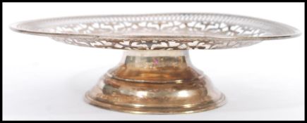 A stamped 925 silver cake stand / tazza with pierced decoration to the plate. Weight 273g.