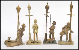 A group of vintage brass Victorian street scenes one depicting police officer and lamppost and the