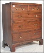 A George III 19th century mahogany bachelors 2 over 3 chest of drawers being raised on ogee  bracket