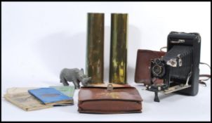 A group of vintage items to include a pair of WW1 militaria brass artillery shells 1916, a carved