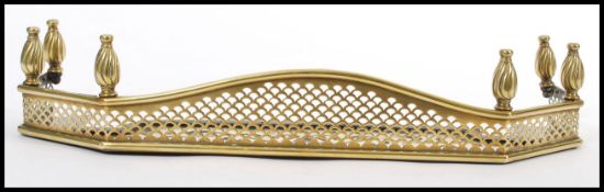 A 19th century Victorian brass Art Nouveau work kerb bedroom fire fender / fire guard of small