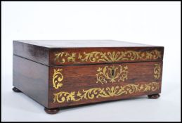 A 19th Century rosewood Victorian sewing /  wood box having inlaid brass scrolled decoration and