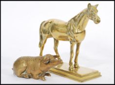 A vintage 20th century cast brass figurine of a horse raised on plinth base along with an unusual