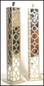 A pair of vintage 20th century mirrored column lam
