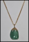 A 20th century 9ct gold  and agate adorned pendant and necklace chain, weight 8.2g.