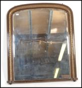 A Victorian 19th century large overmantel mirror having a giltwood large frame with arched top and
