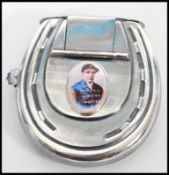 A silver plated vesta case in the form of a vesta case having an enamelled panel to the front