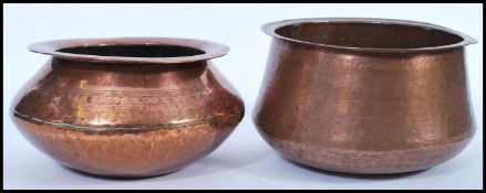 Two late 19th century / early 20th century Arts and Crafts large copper planters / bowls having