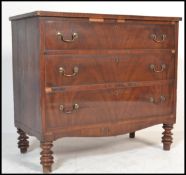 A 19th century flame mahogany Georgian chest of drawers raised on turned legs. The straight bank